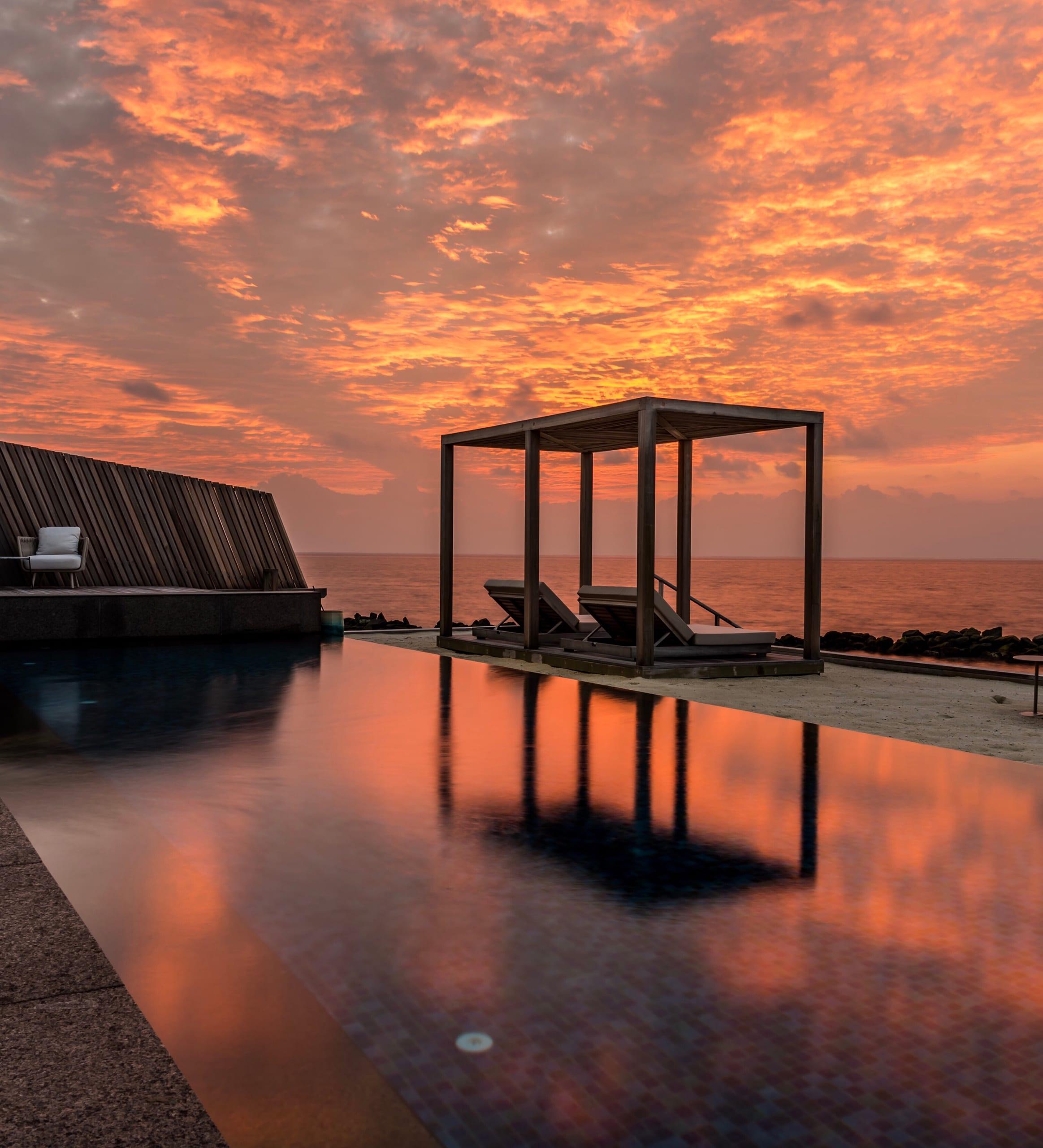 A sunset infinity pool at a private retreat