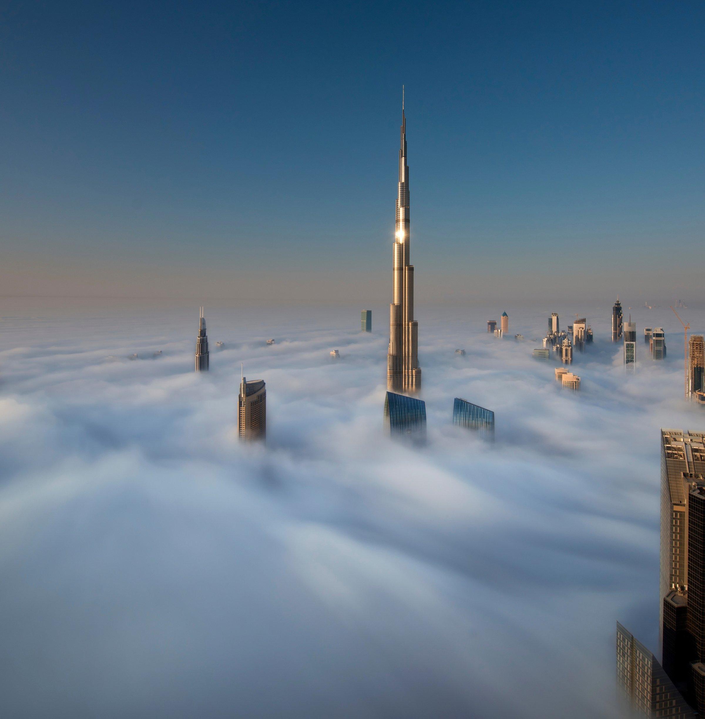 Dubai skyline above the clouds
