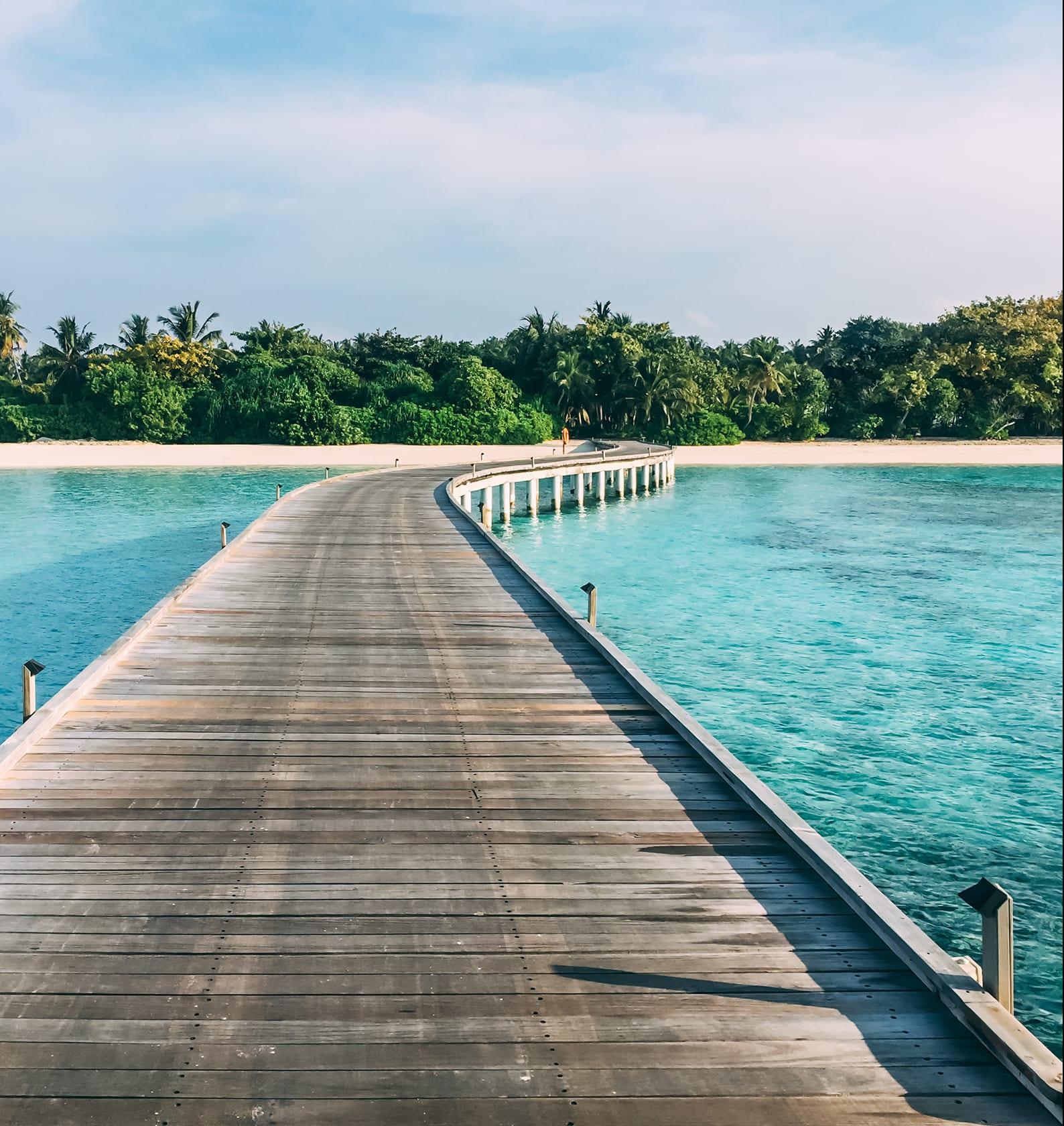 An overwater villa above a turquoise lagoon