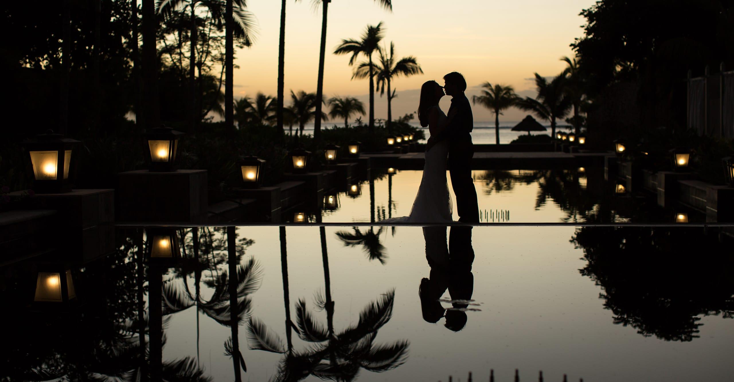 A couple at a Zameera property at sunset